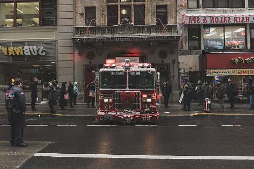 new york red and white truck near building fire engine